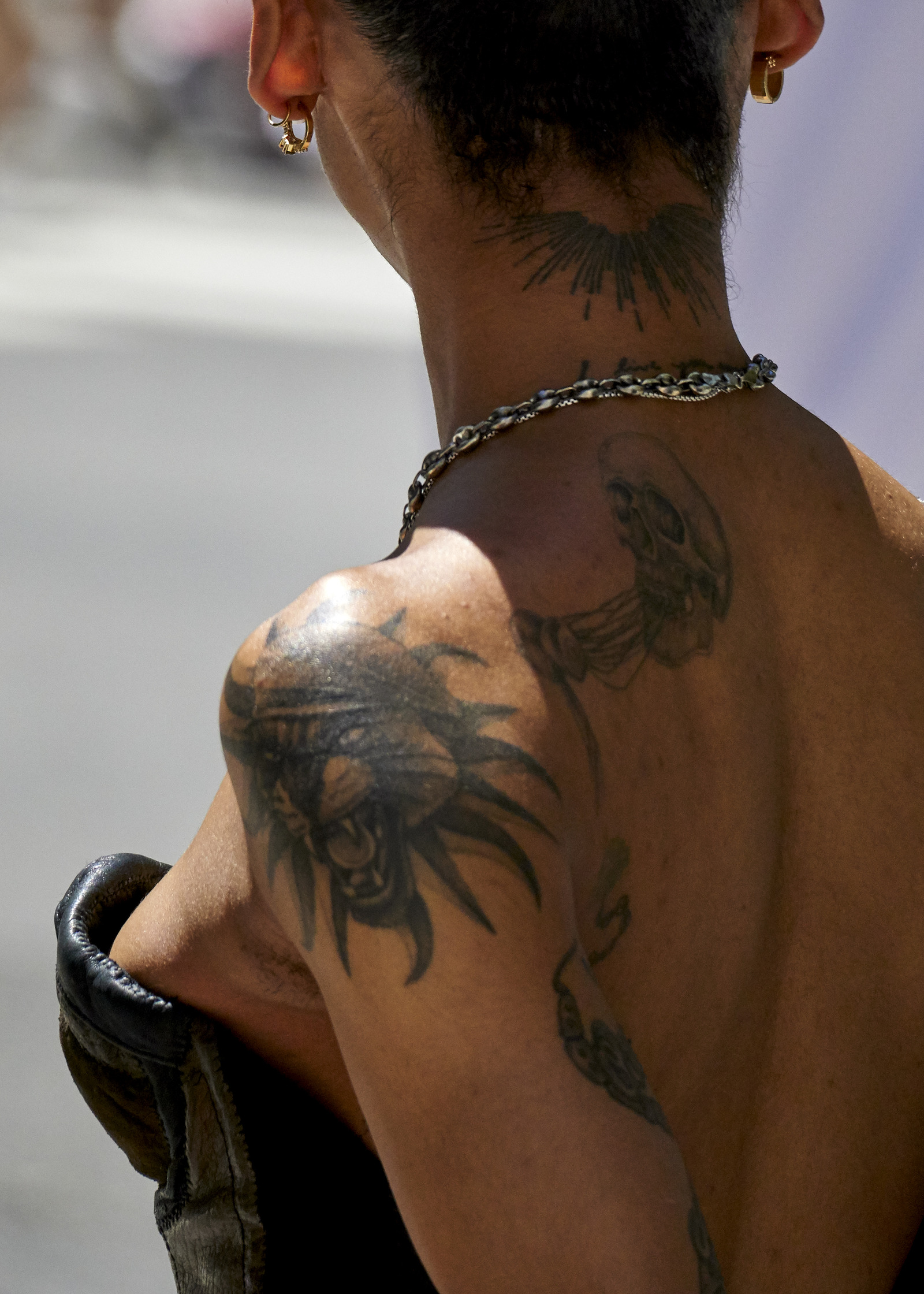 a woman with tattoos on her back