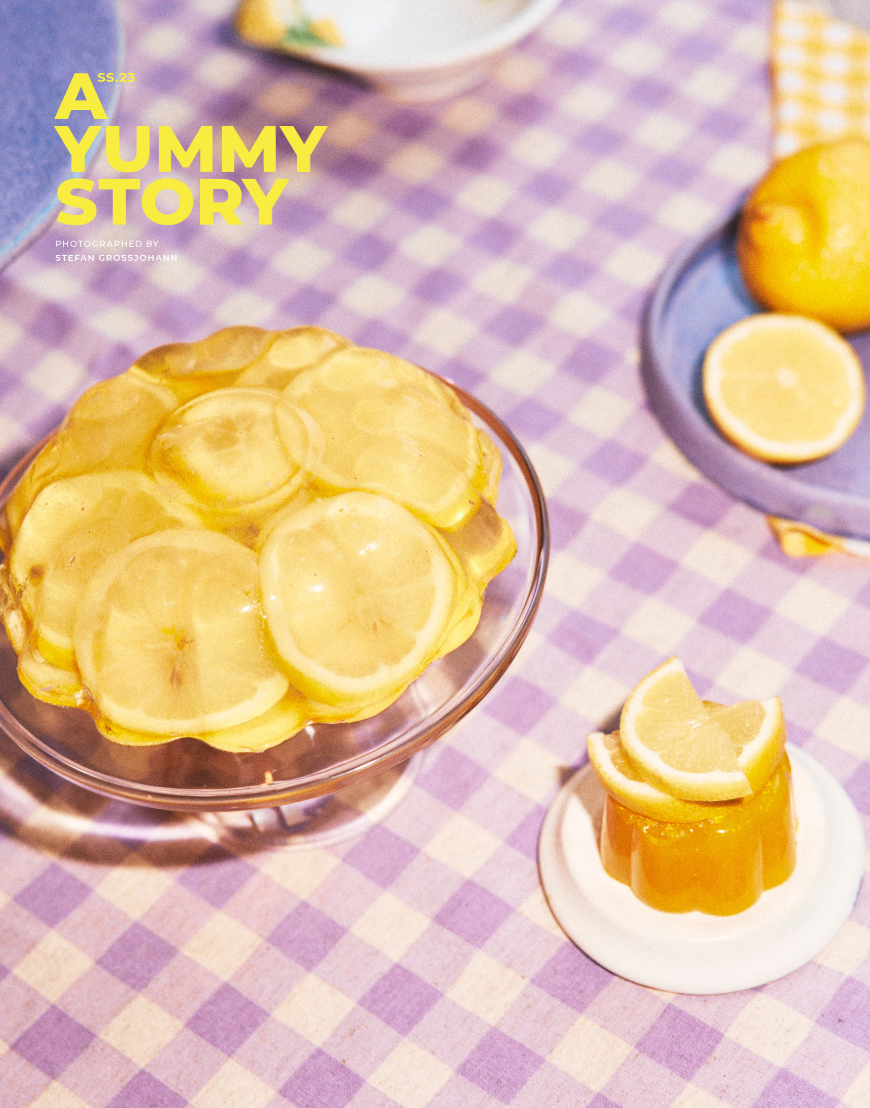 a plate of lemon slices on a checkered tablecloth