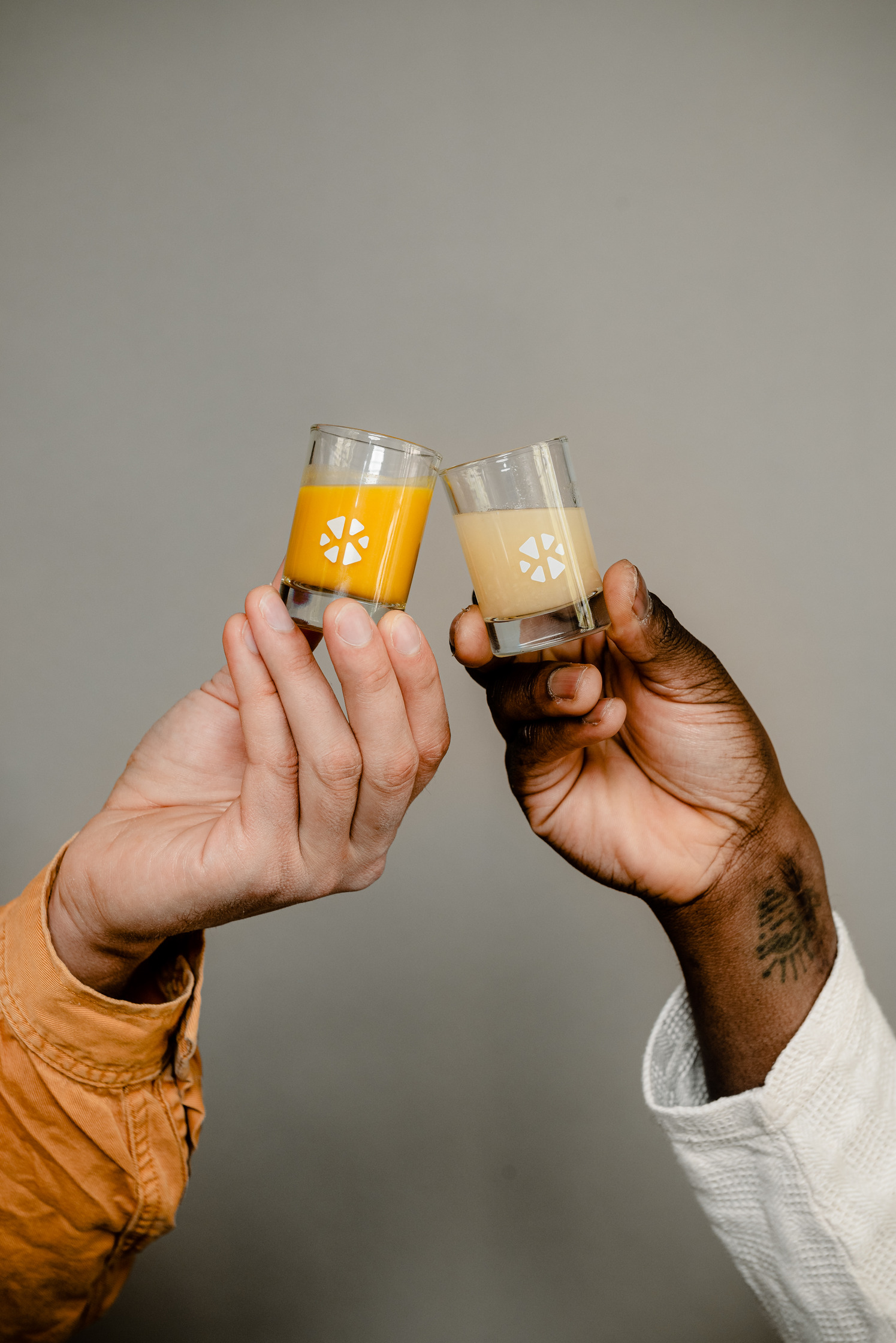 two people toasting a glass of klosterkitchen shot