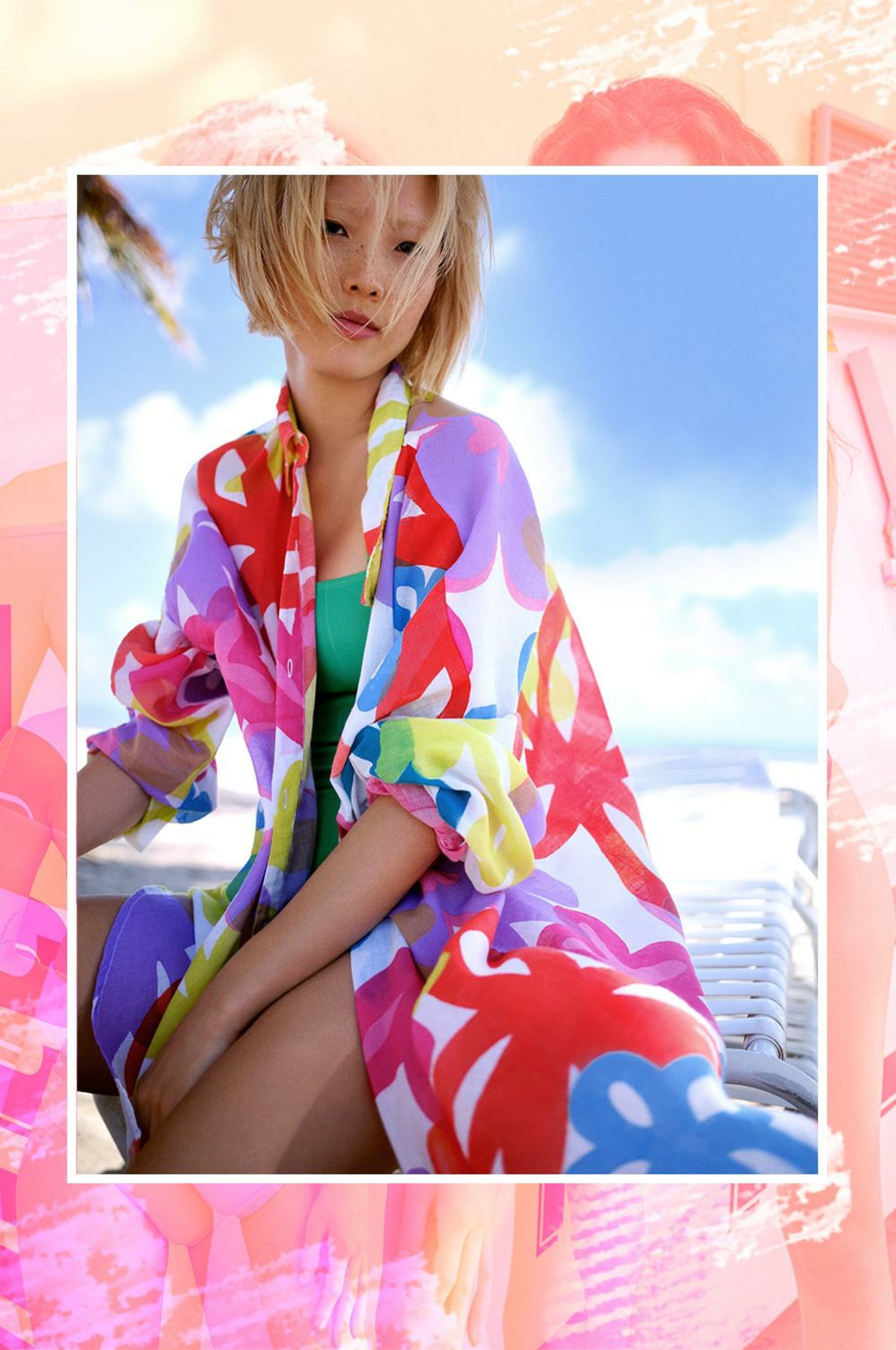 a girl in a colorful kimono is sitting on a bench