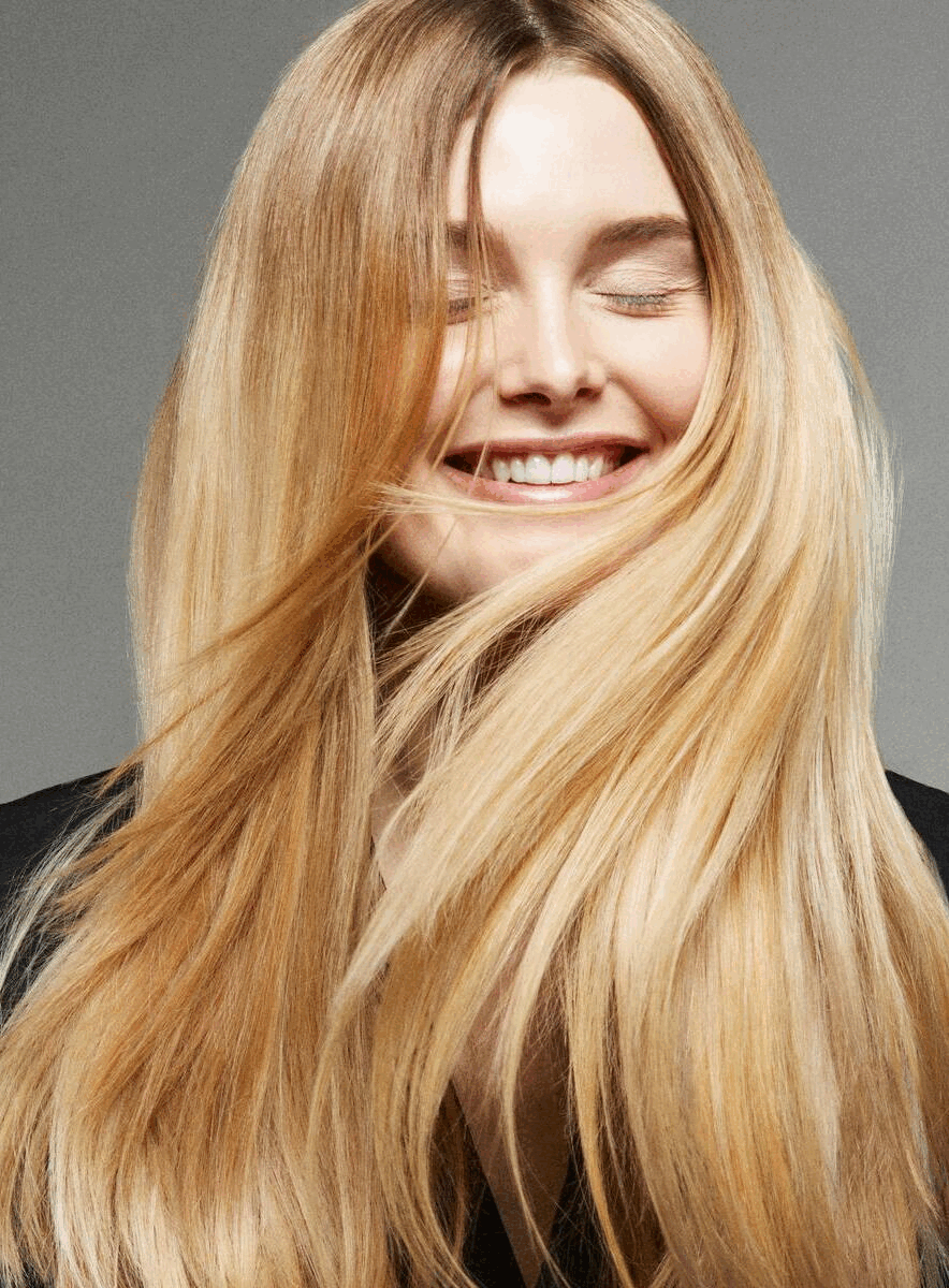 a woman with long blonde hair is smiling beauty photography by photographer Frauke Fischer