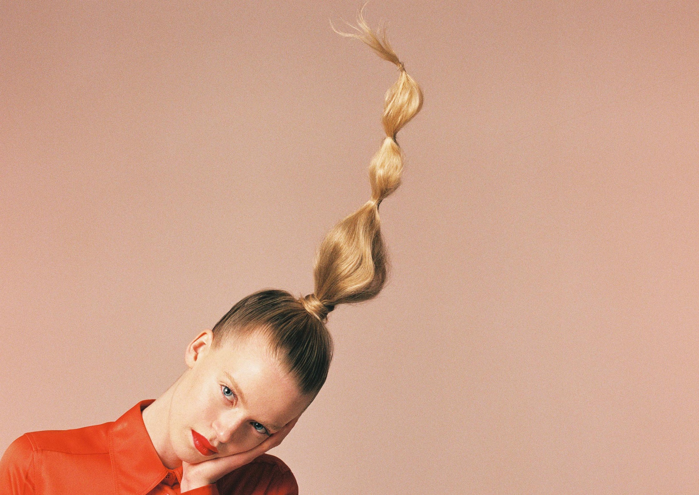 a woman with her hair up in a ponytail fashion photographer Fraukle Fischer