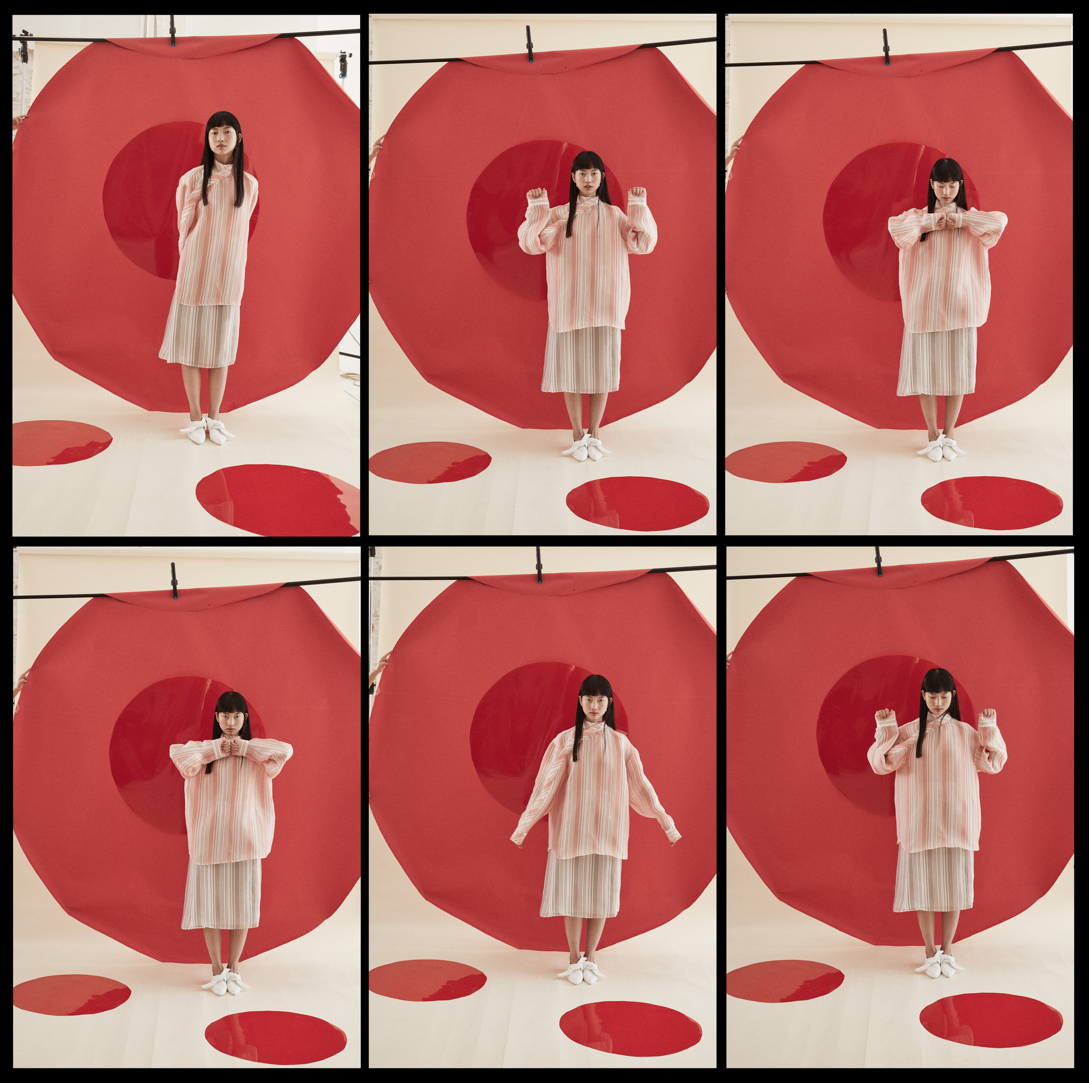 a girl poses in front of a red circle  by fashion photographer frauke fischer