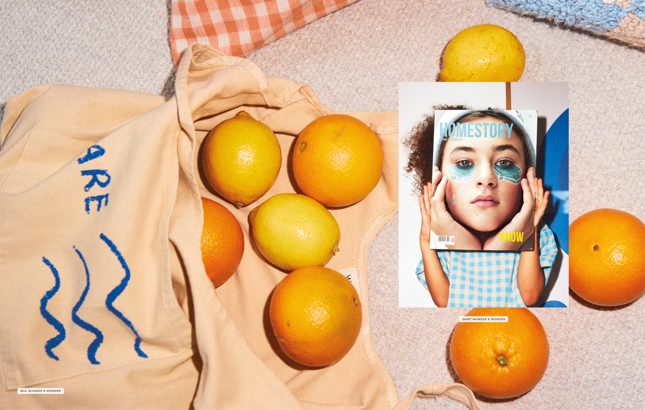 a bag with oranges and a picture of a girl